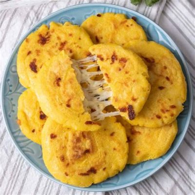 Arepas de Queso: Een Zacht Gebakken Heerlijkheid met een Kaasachtige Kern!